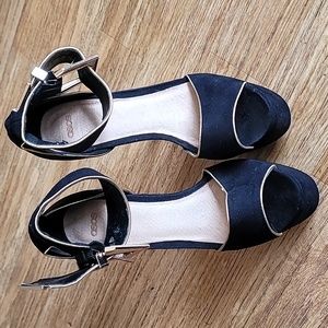 Asos black and gold trim with buckle 8 inch heels. Has some tears by buckle.